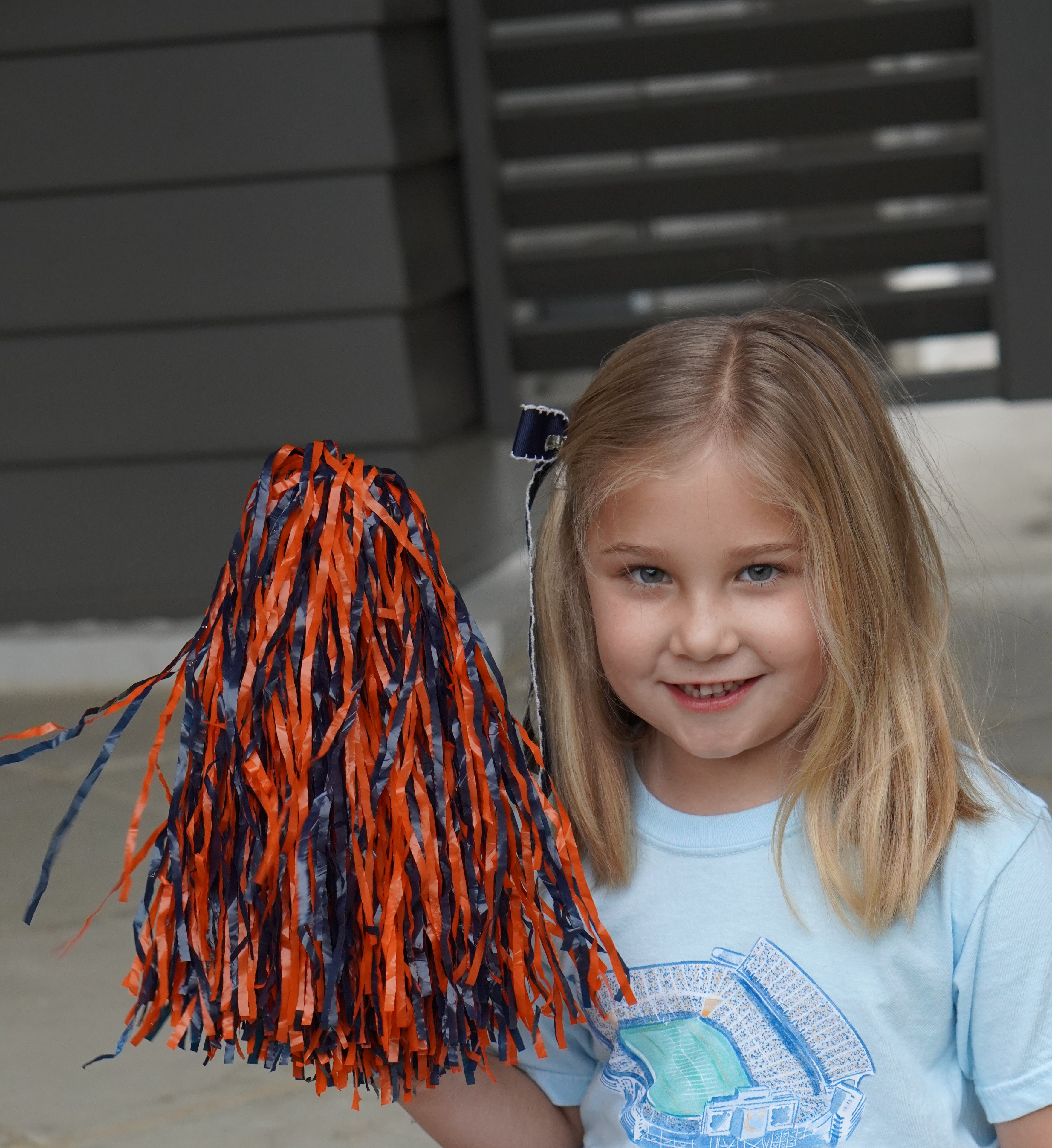 Auburn University Light Blue Youth T-Shirts with a watercolor illustration of Jordan-Hare Stadium