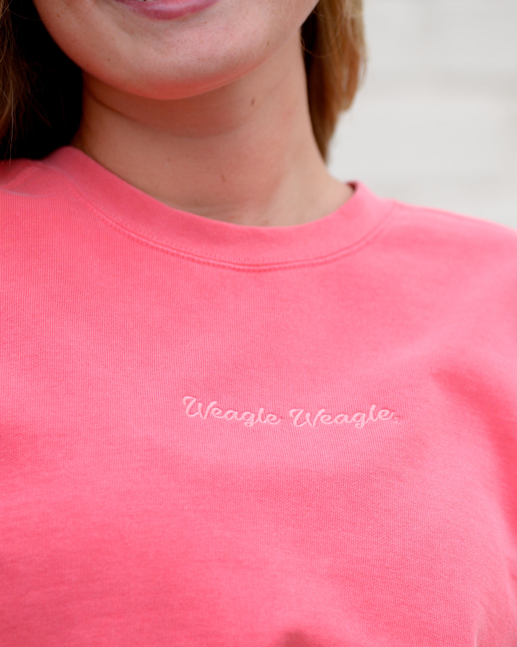 Auburn University Coral Ladies' Sweatshirt with Coral embroidered text "Weagle Weagle”