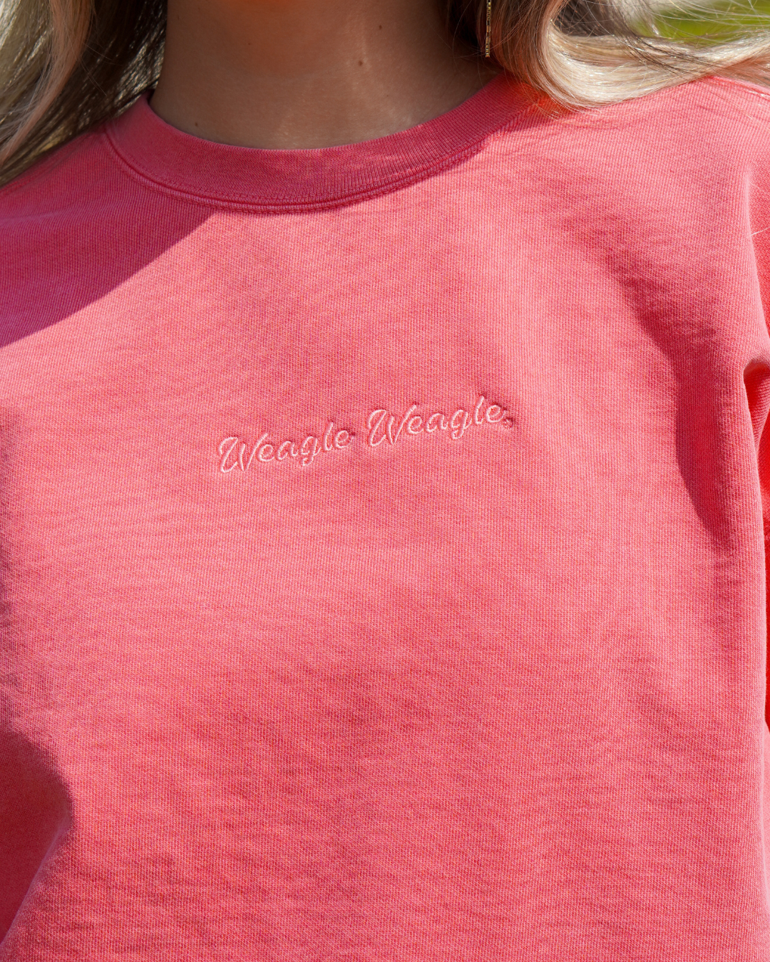 Auburn University Coral Ladies' Sweatshirt with Coral embroidered text "Weagle Weagle”