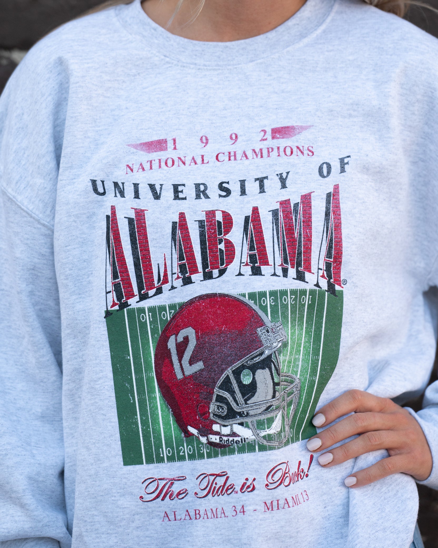 University of Alabama 1992 National Champions Gildan Ash Sweatshirt  with a graphic print of a football helmet and the text '1992 National Champions UNIVERSITY OF ALABAMA'.