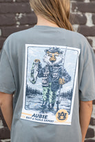 Auburn University Aubie Fishing Comfort Colors Grey T-Shirt with image of Aubie standing in the water holding a fishing pole