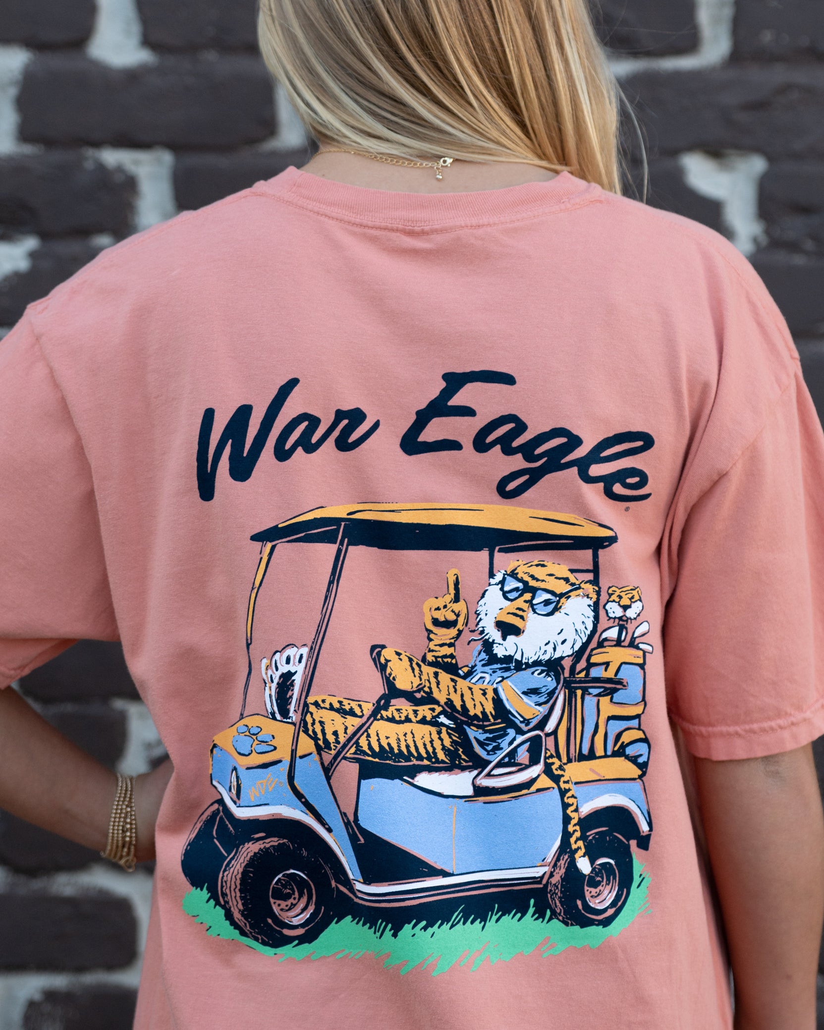 Auburn University Aubie Golf Cart Terracotta Comfort Colors T-Shirt  with the text "War Eagle" above an image of Aubie the Tiger wearing sunglasses and driving a golf cart