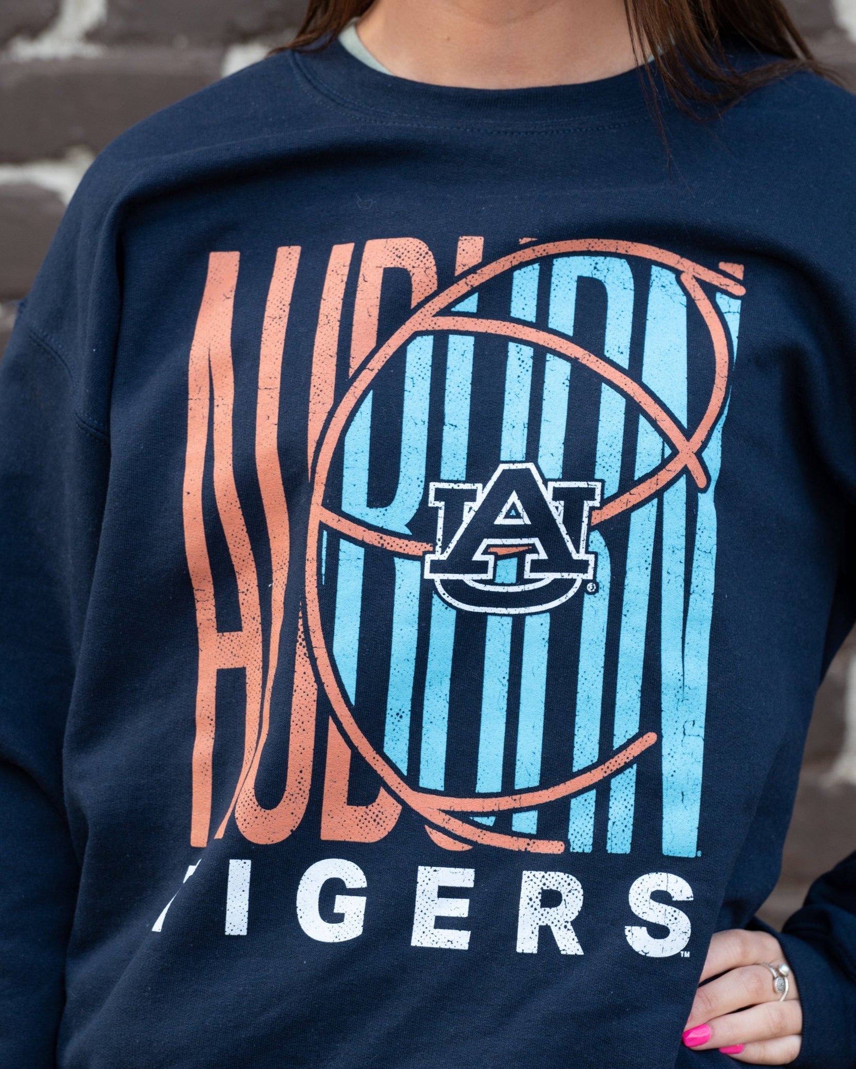 Auburn University Auburn Basketball Gildan Navy Sweatshirt Auburn Tigers basketball sweatshirt in orange and blue colors with a retro inspired graphic design