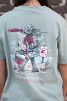 University of Alabama Big Al Beach Chalky Mint Comfort Colors T-Shirt with an image of Big Al in beach clothes carrying an umbrella dragging a cooler across the sand