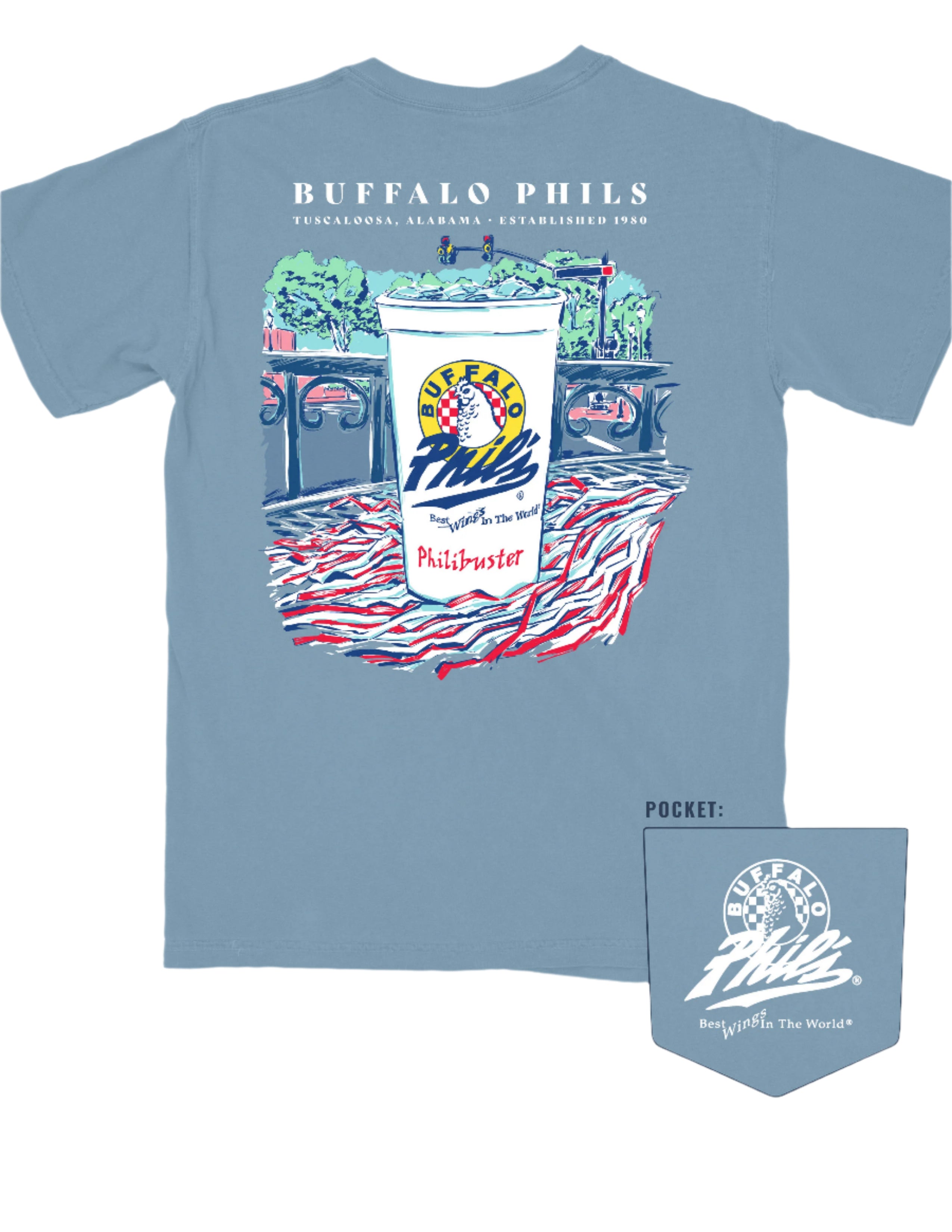 Ice Blue Buffalo Phil's T-Shirt with an image of a Buffalo Phil's cup sitting on top of a shaker on a table looking out on The Strip
