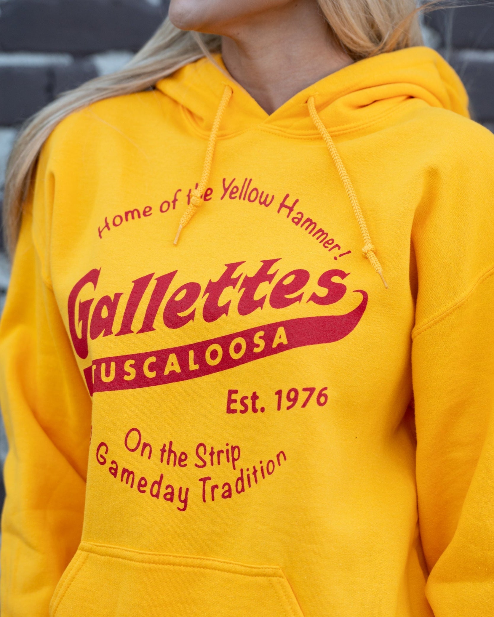 Gallettes Yellow Hoodie with a Red Gallettes logo surrounded by Red text "Home of the Yellow Hammer!" and "On the Strip gameday Tradition"
