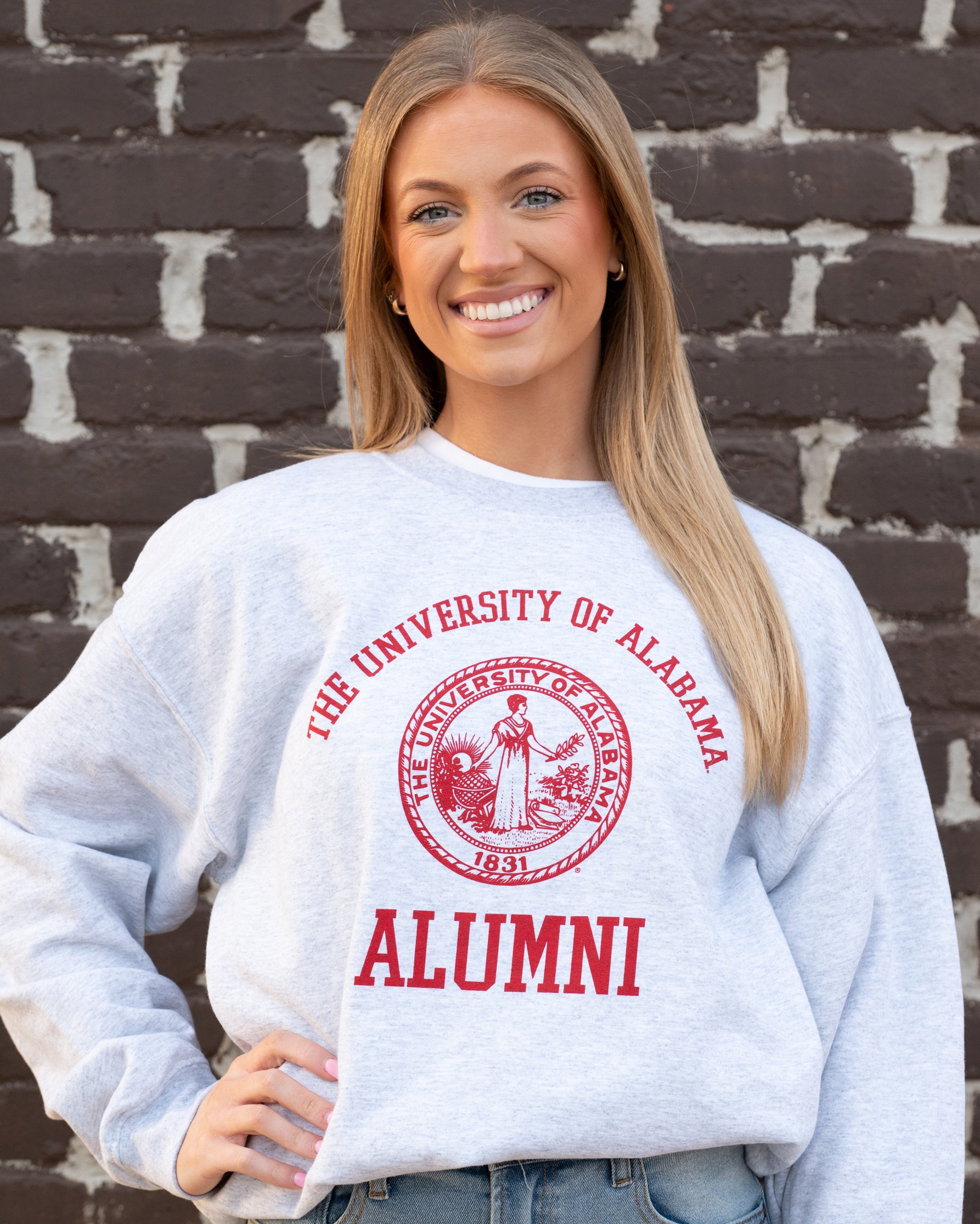 University of Alabama Light Grey Alumni Sweatshirt with Red text "University of Alabama" above the Red Alumni Seal and Red text "Alumni" below