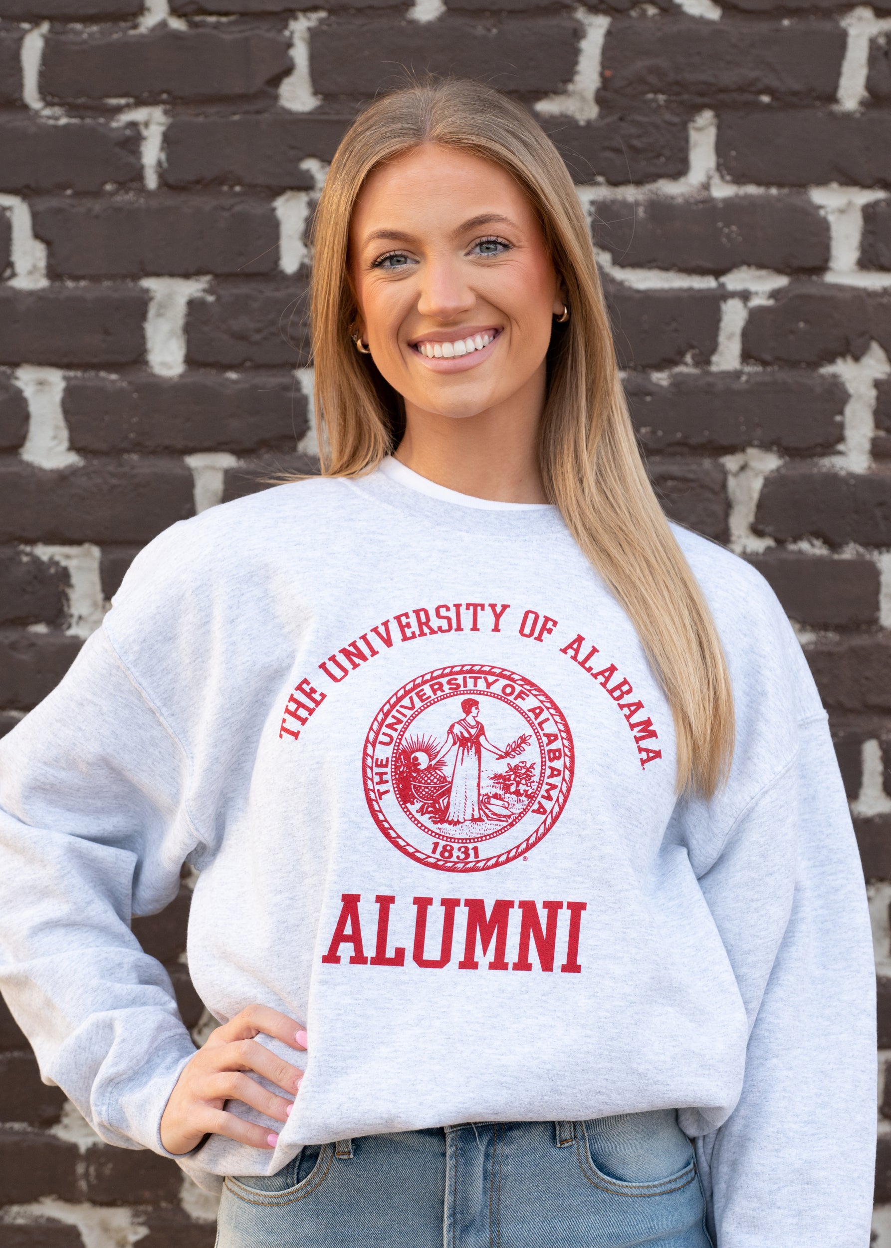 University of Alabama Light Grey Alumni Sweatshirt with Red text "University of Alabama" above the Red Alumni Seal and Red text "Alumni" below