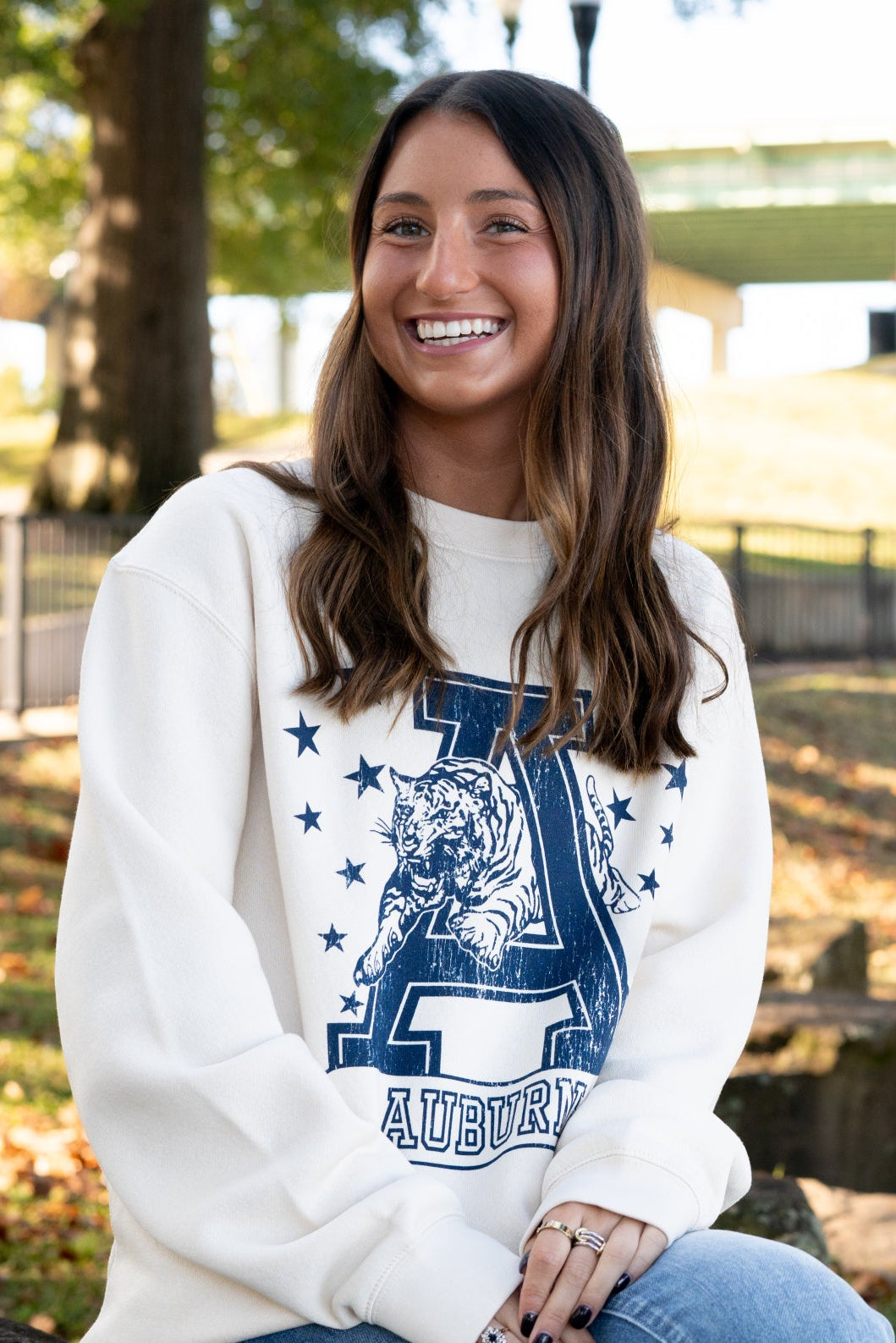Auburn University Ivory Sweatshirt with Navy stars surrounding a Navy Leaping Tiger Logo