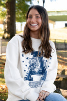 Auburn University Ivory Sweatshirt with Navy stars surrounding a Navy Leaping Tiger Logo