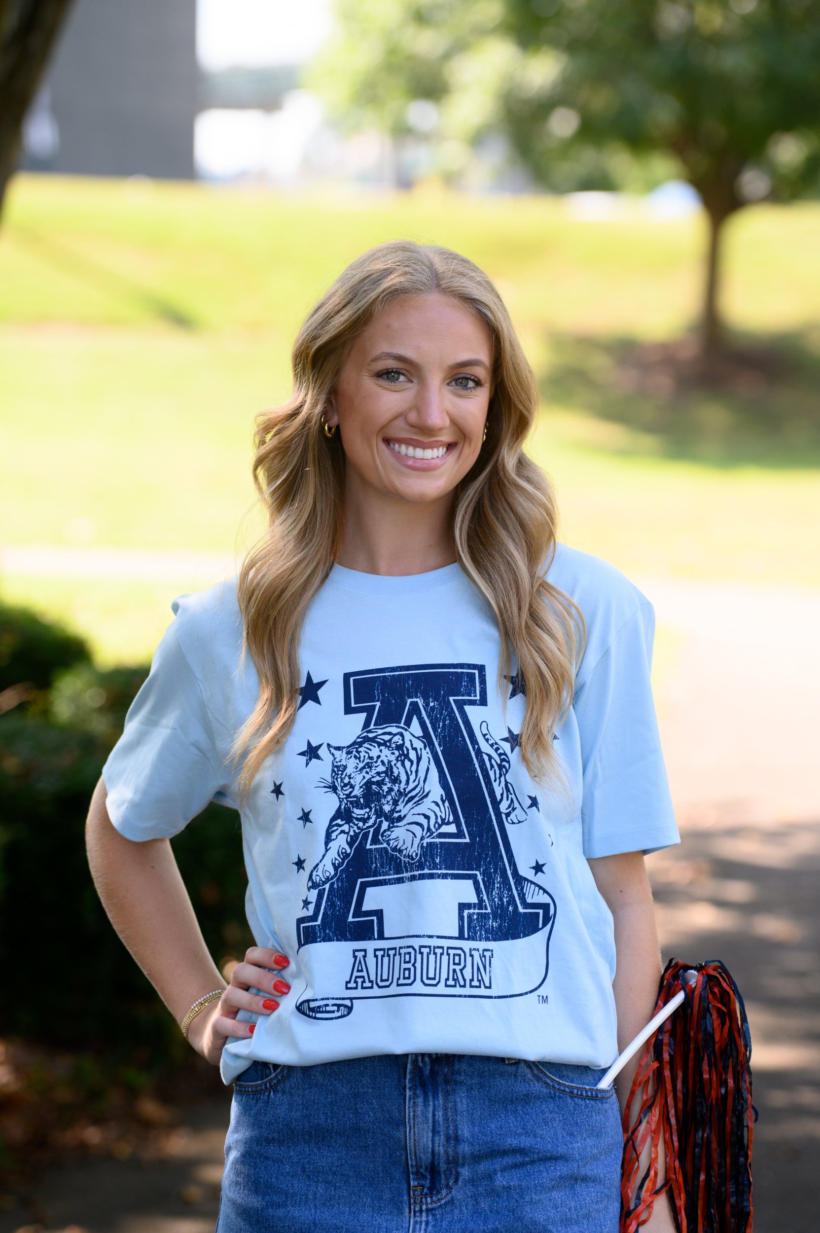 Auburn University Light Blue T-Shirt with Navy stars surrounding a Navy Leaping Tiger Logo