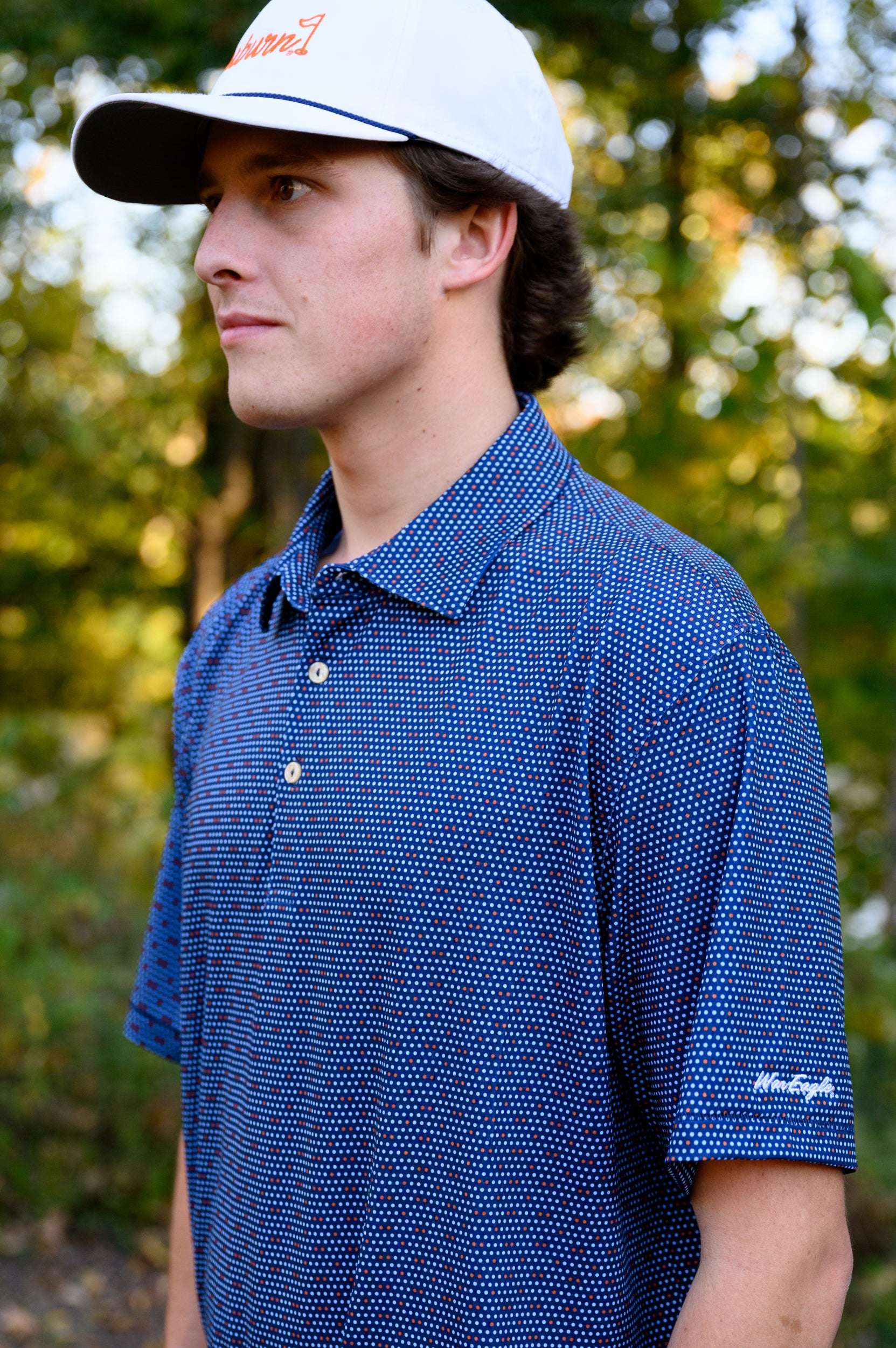 Auburn University Navy Men's Dot Polo with Light Blue and Orange dots and White "War Eagle" embroidery on the sleeve