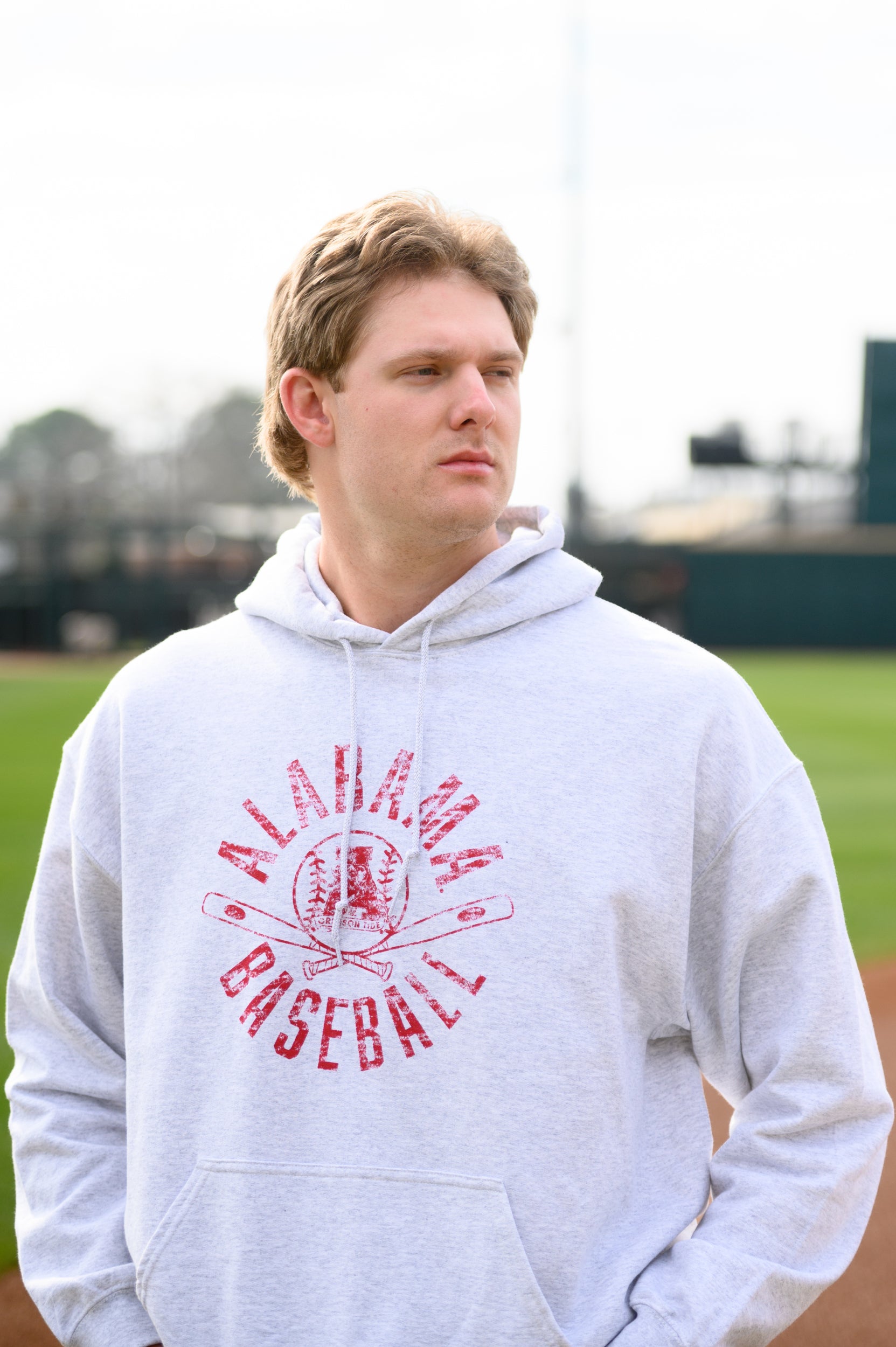 University of Alabama Distressed Light Grey Hoodie with a Red Baseball featuring the Vintage A logo over crossed baseball bats, surrounded by Red text “Alabama Baseball”