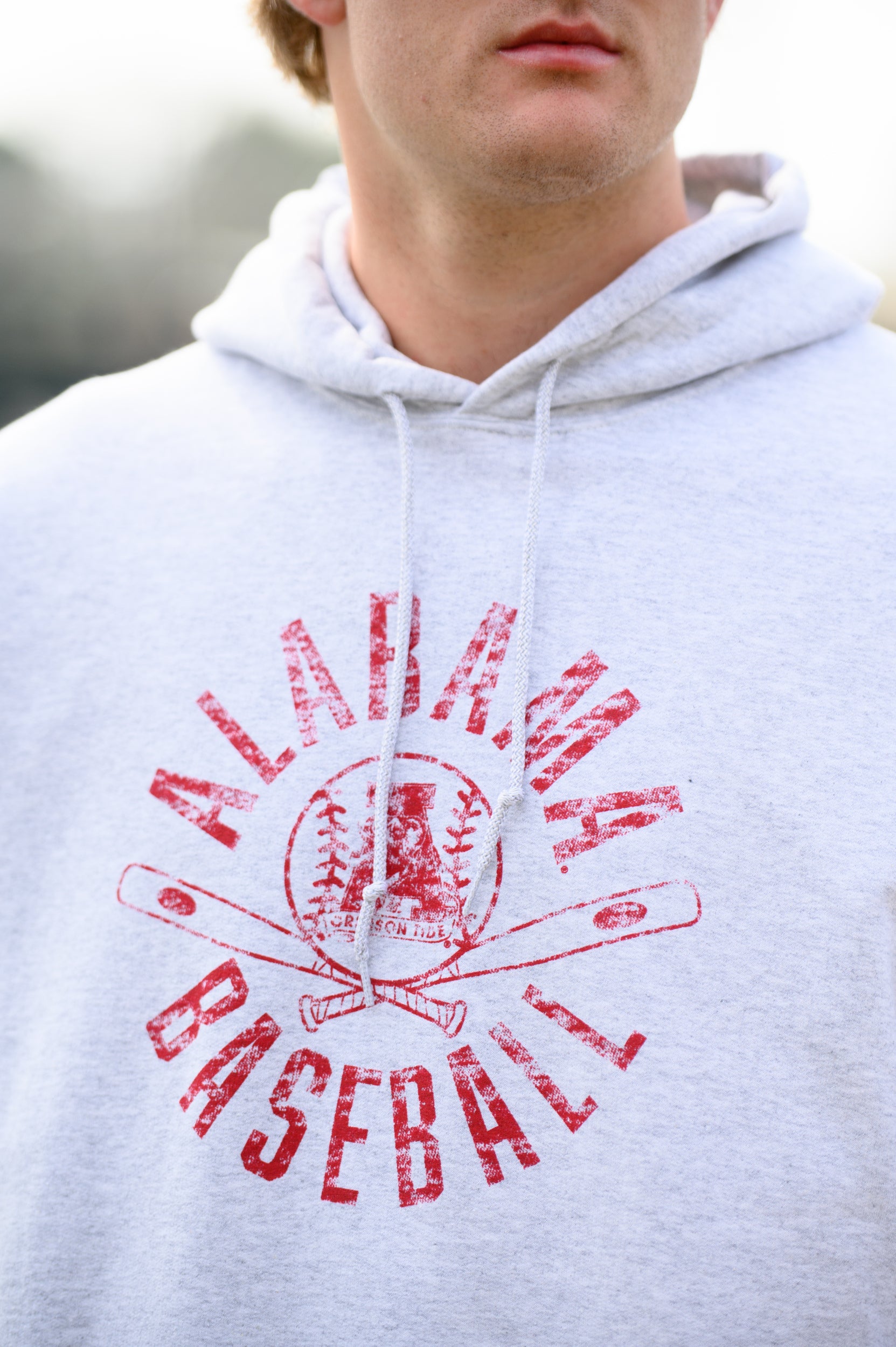 University of Alabama Distressed Light Grey Hoodie with a Red Baseball featuring the Vintage A logo over crossed baseball bats, surrounded by Red text “Alabama Baseball”