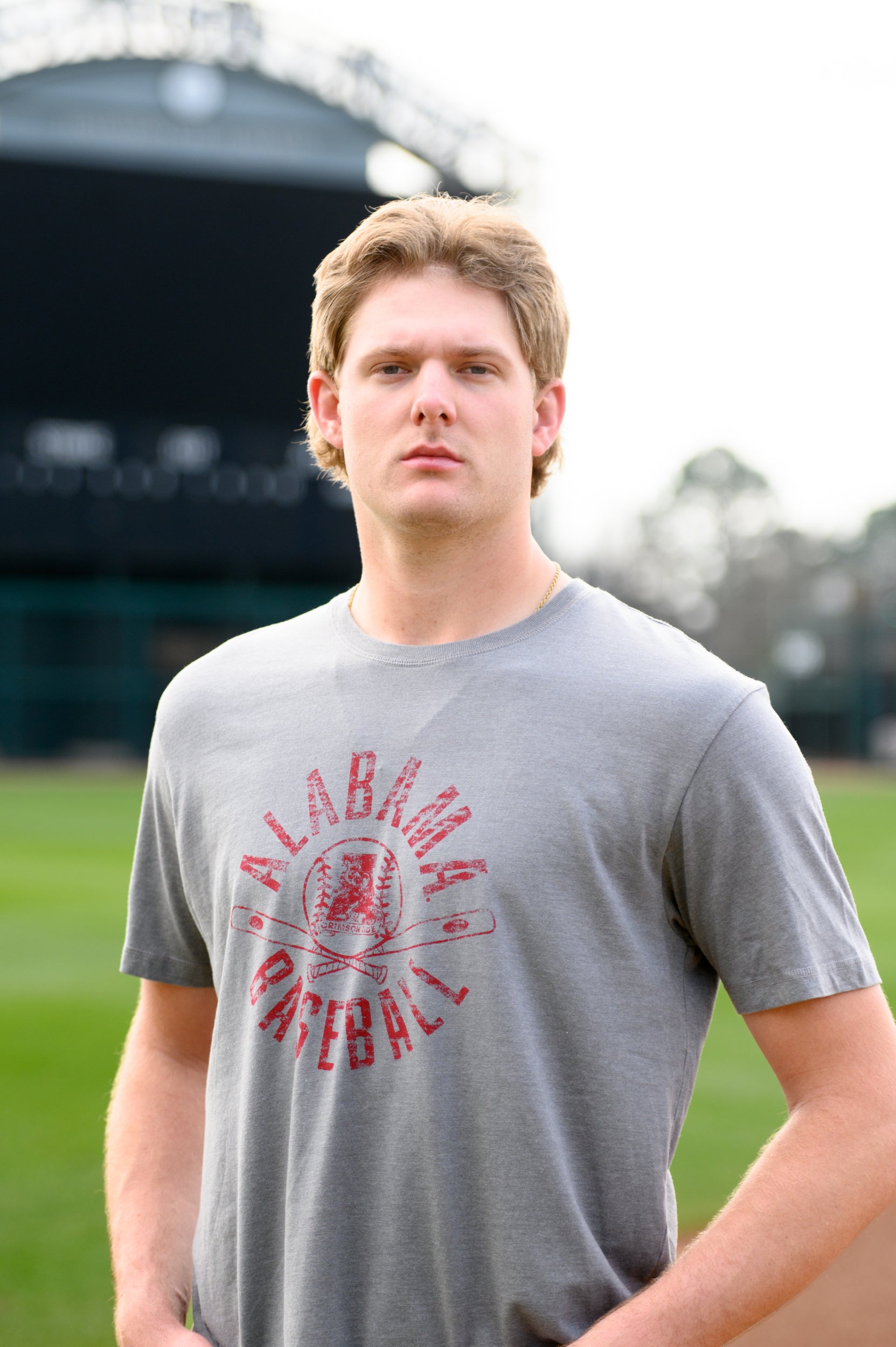 University of Alabama Distressed Grey T-Shirt with a Red Baseball featuring the Vintage A logo over crossed baseball bats, surrounded by White text “Alabama Baseball”