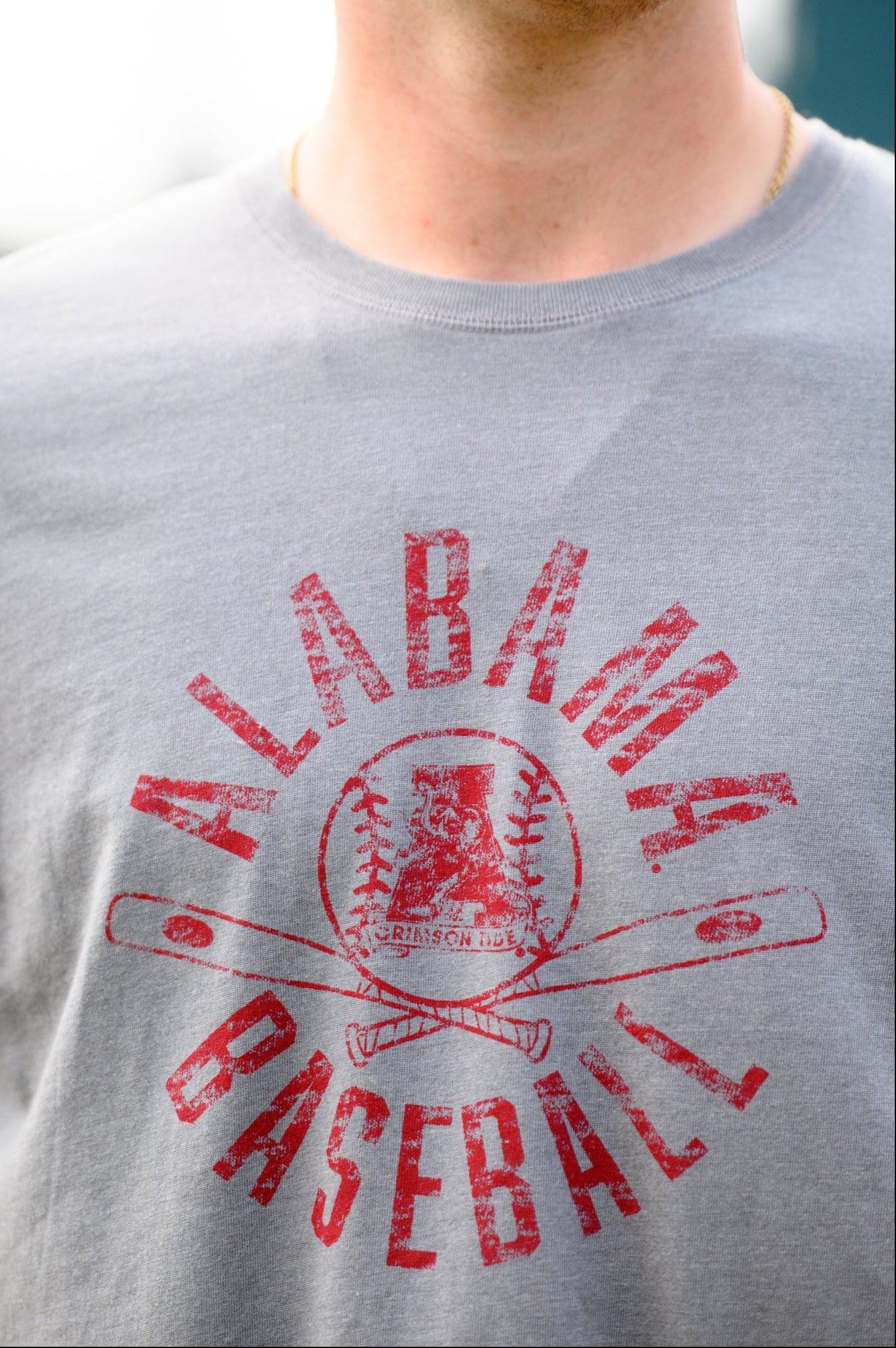 University of Alabama Distressed Grey T-Shirt with a Red Baseball featuring the Vintage A logo over crossed baseball bats, surrounded by White text “Alabama Baseball”