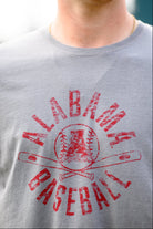 University of Alabama Distressed Grey T-Shirt with a Red Baseball featuring the Vintage A logo over crossed baseball bats, surrounded by White text “Alabama Baseball”