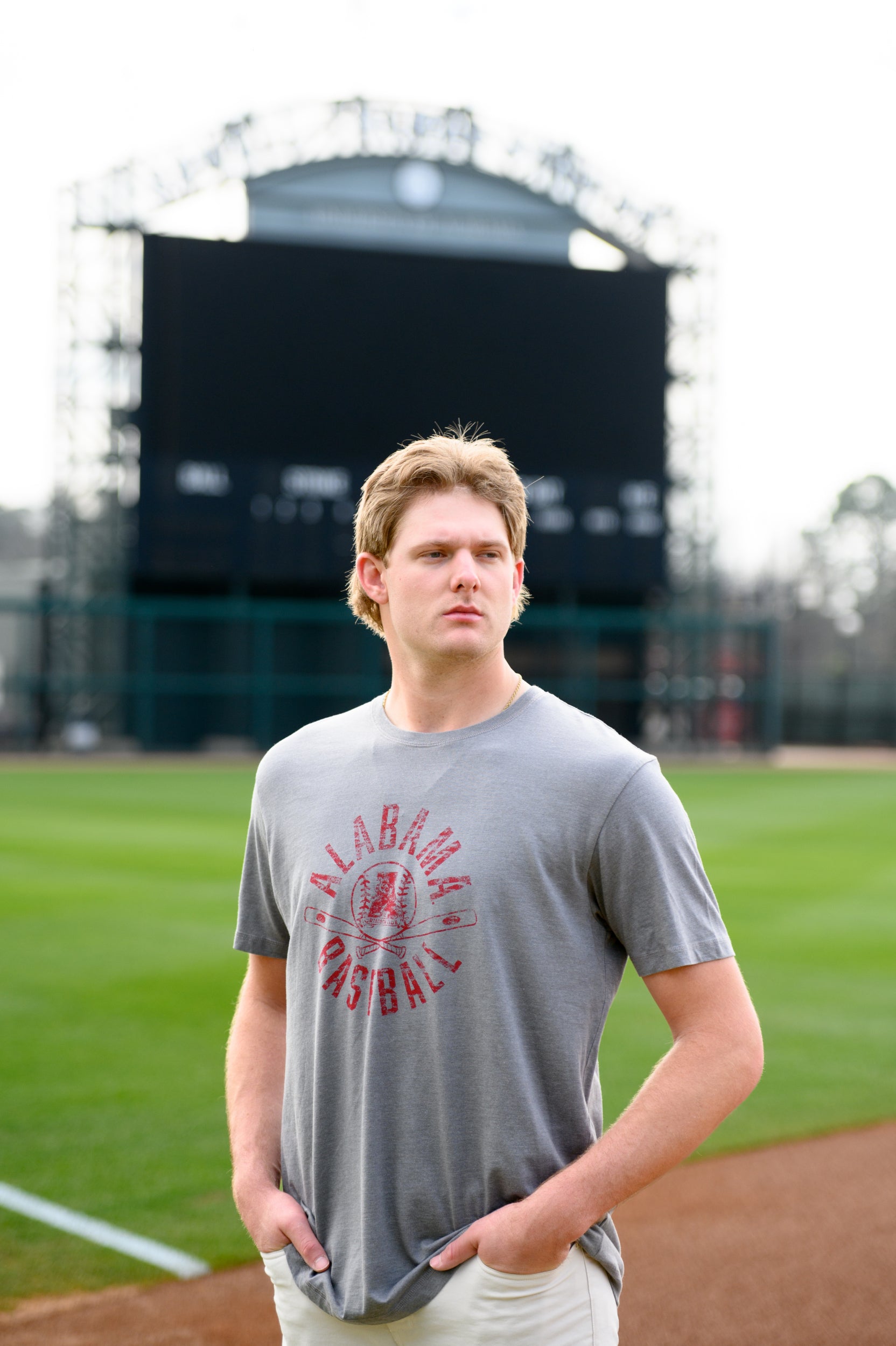 University of Alabama Distressed Grey T-Shirt with a Red Baseball featuring the Vintage A logo over crossed baseball bats, surrounded by White text “Alabama Baseball”