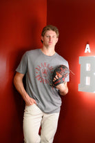 University of Alabama Distressed Grey T-Shirt with a Red Baseball featuring the Vintage A logo over crossed baseball bats, surrounded by White text “Alabama Baseball”