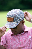 University of Alabama Alabama Leather Patch Hat Duck Camo JNJ 7-Panel Hat with White rope and Leather patch with text "University of Alabama"