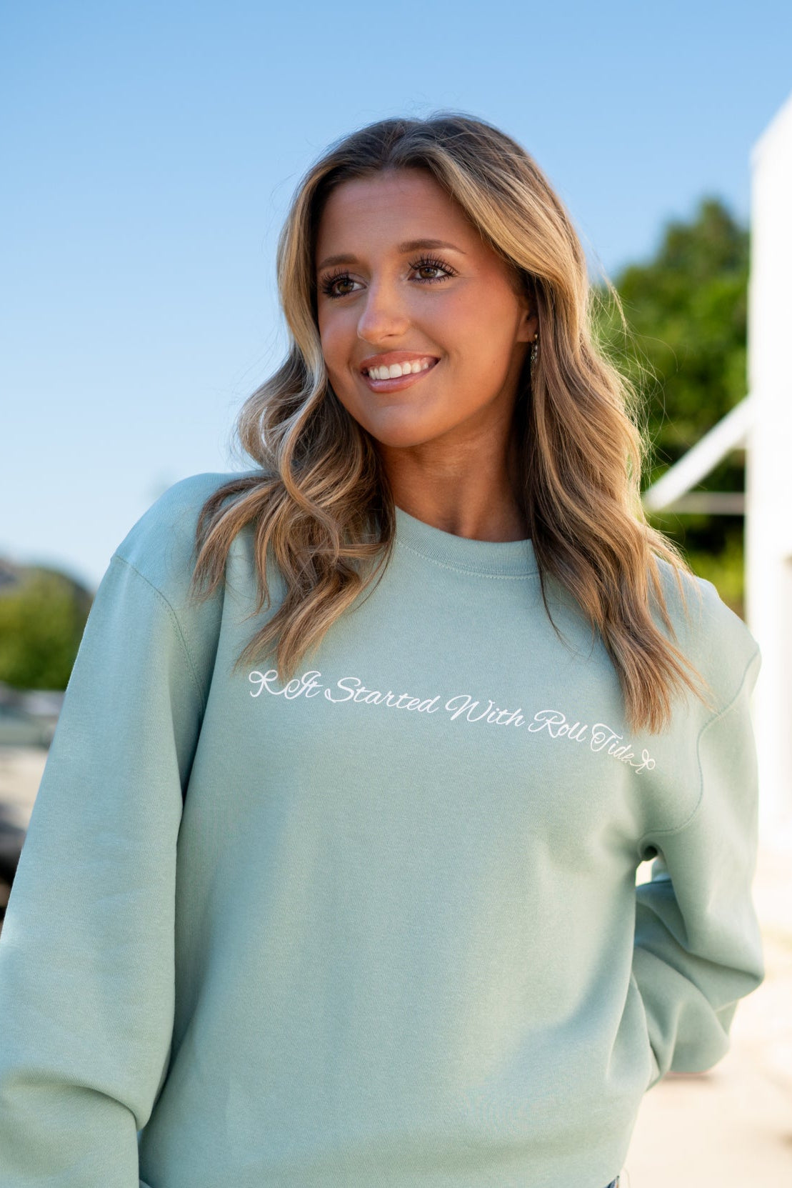 University of Alabama Seafoam Crewneck with cursive writing on the front and an open locket with the writing “Bama” inside on the back