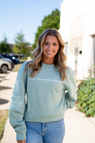 University of Alabama Seafoam Crewneck with cursive writing on the front and an open locket with the writing “Bama” inside on the back