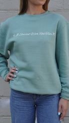 University of Alabama Seafoam Crewneck with cursive writing on the front and an open locket with the writing “Bama” inside on the back