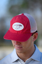 University of Alabama Red Trucker Hat featuring a patch with an image of a fishing lure with Red text "Alabama"