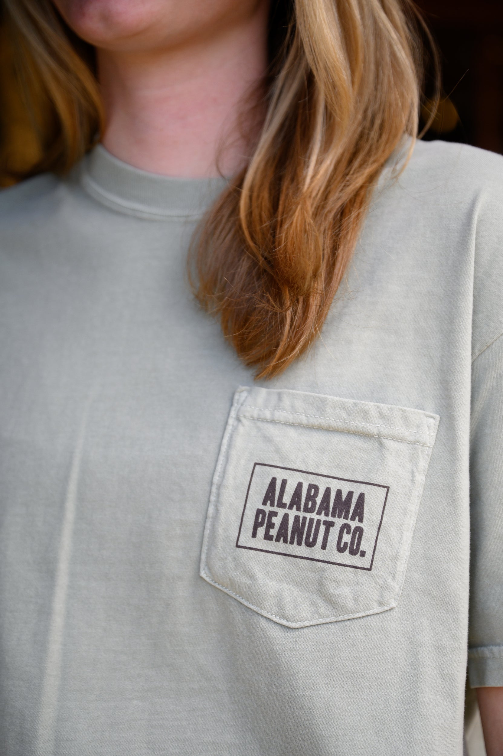 Front Pocket with Brown “Alabama Peanut Co.” Text