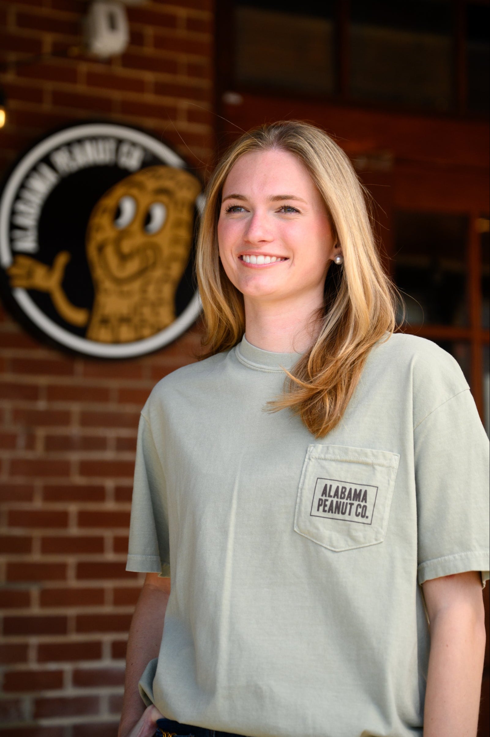 Front Pocket with Brown “Alabama Peanut Co.” Text