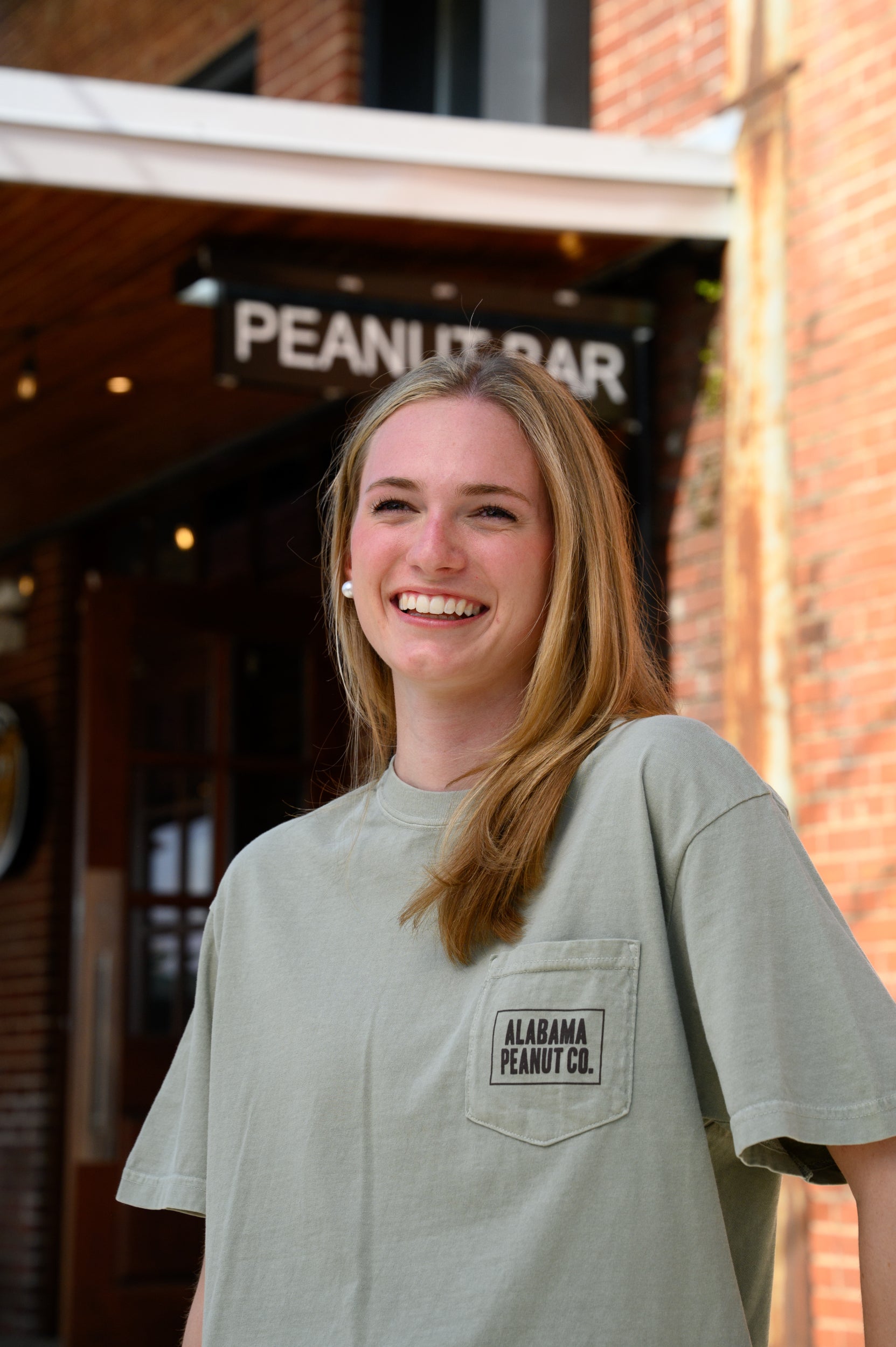 Front Pocket with Brown “Alabama Peanut Co.” Text