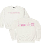 Local Merch Off-White Crewneck with Pink Text “Tuscaloosa” on the front, and Pink sketches of Denny Chimes, Bryant-Denny Stadium, the Tuska Stature, and President’s Mansion on the back