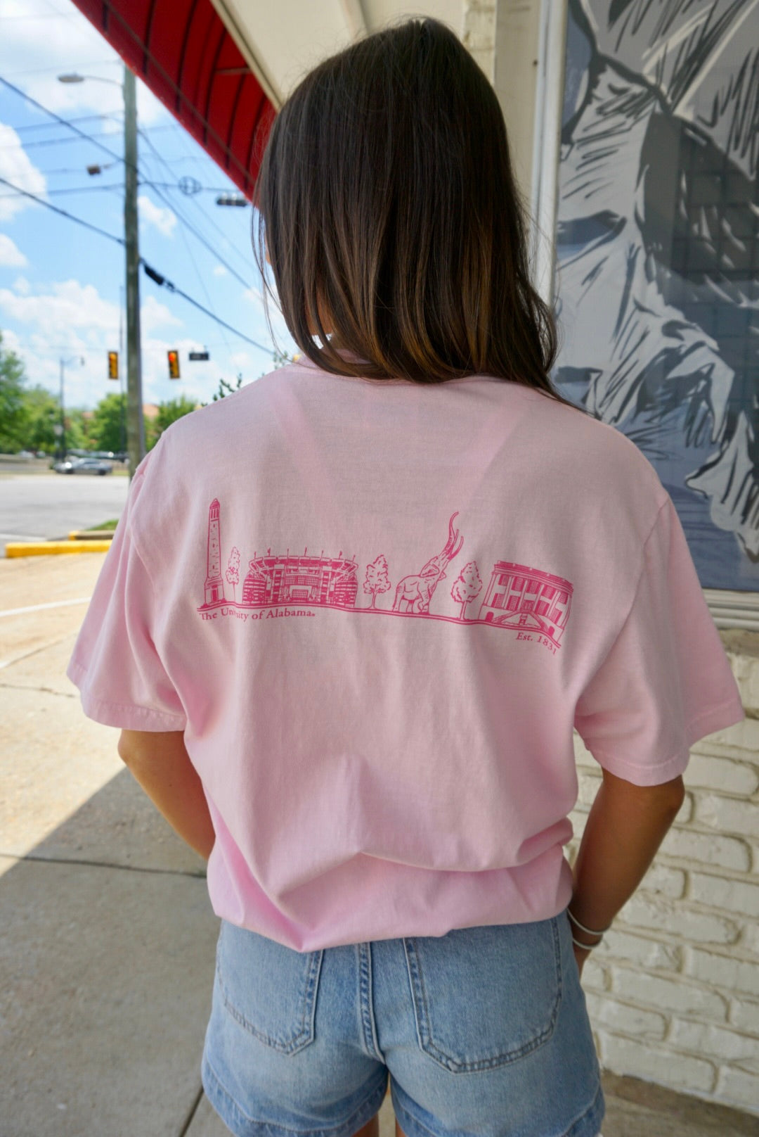 Local Merch Light Pink T-Shirt with Pink sketches of Denny Chimes, Bryant-Denny Stadium, the Tuska Stature, and President’s Mansion on the back