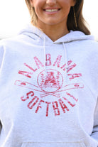 University of Alabama Distressed Light Grey Hoodie with a Red Softball featuring the Vintage A logo over crossed softball bats, surrounded by Red text “Alabama Softball”