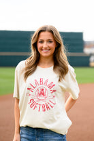 University of Alabama Distressed Ivory T-Shirt with a Red Softball featuring the Vintage A logo over crossed Softball bats, surrounded by Red text “Alabama Softball”