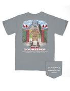 University of Alabama Grey T-Shirt with an illustration of Big Al standing outside of a football field in a zookeeper's outfit above the words “Big AL Zoukeeper”