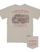 University of Alabama Beige Shirt with Red text “Alabama vs. Oklahoma Homecoming 2025” above an illustration of an old west style general store with a cart outside painted with “See Ya Sooners!” in Red paint