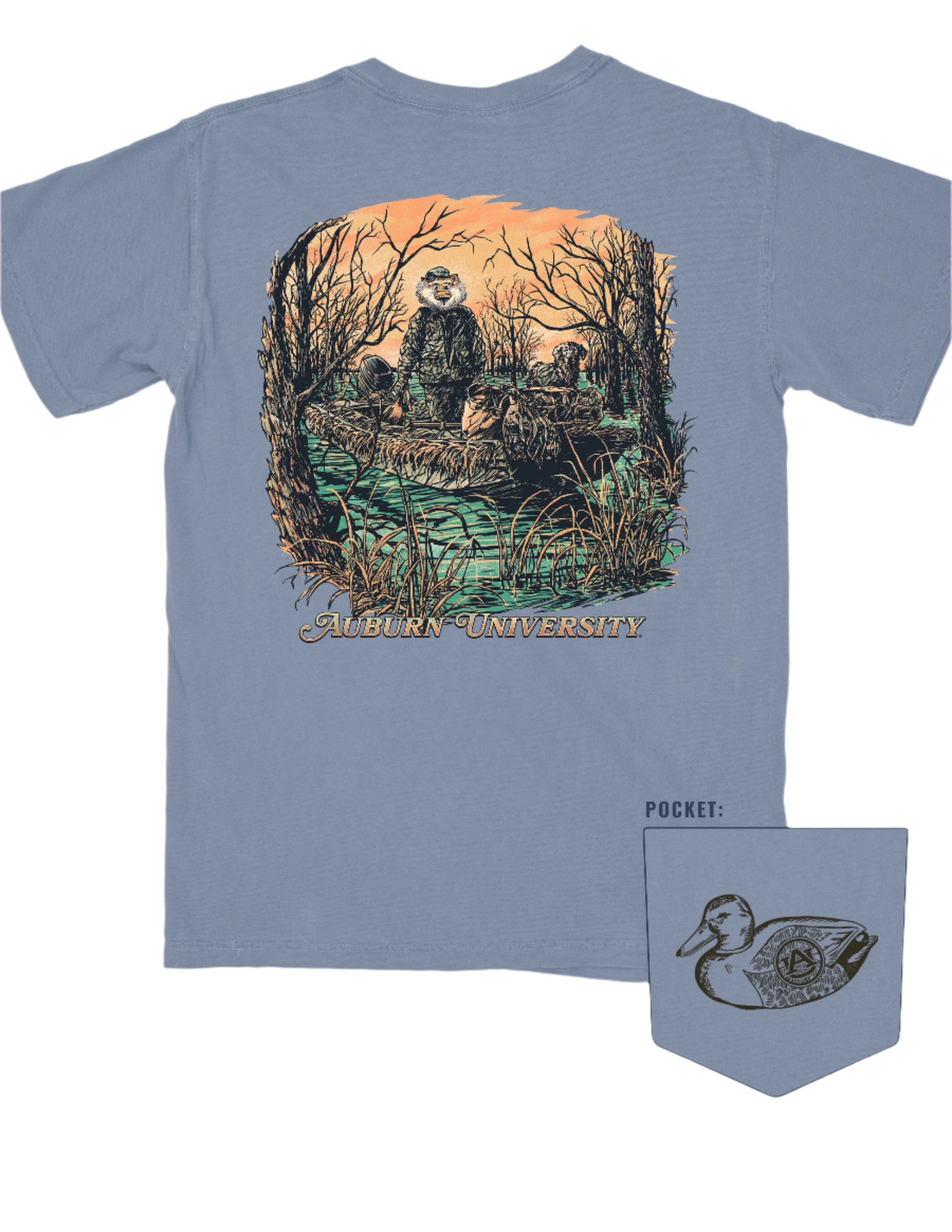 Auburn University Aubie Duck Hunt Blue Jean Comfort Colors T-Shirt with an image of Aubie the Tiger wearing hunting gear with a dog in a boat in the swamp