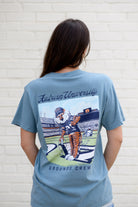 Auburn University Aubie Grounds Crew Ice Blue Comfort Colors T-Shirt with an image of Aubie the Tiger wearing a hat and painting the turf on the football field