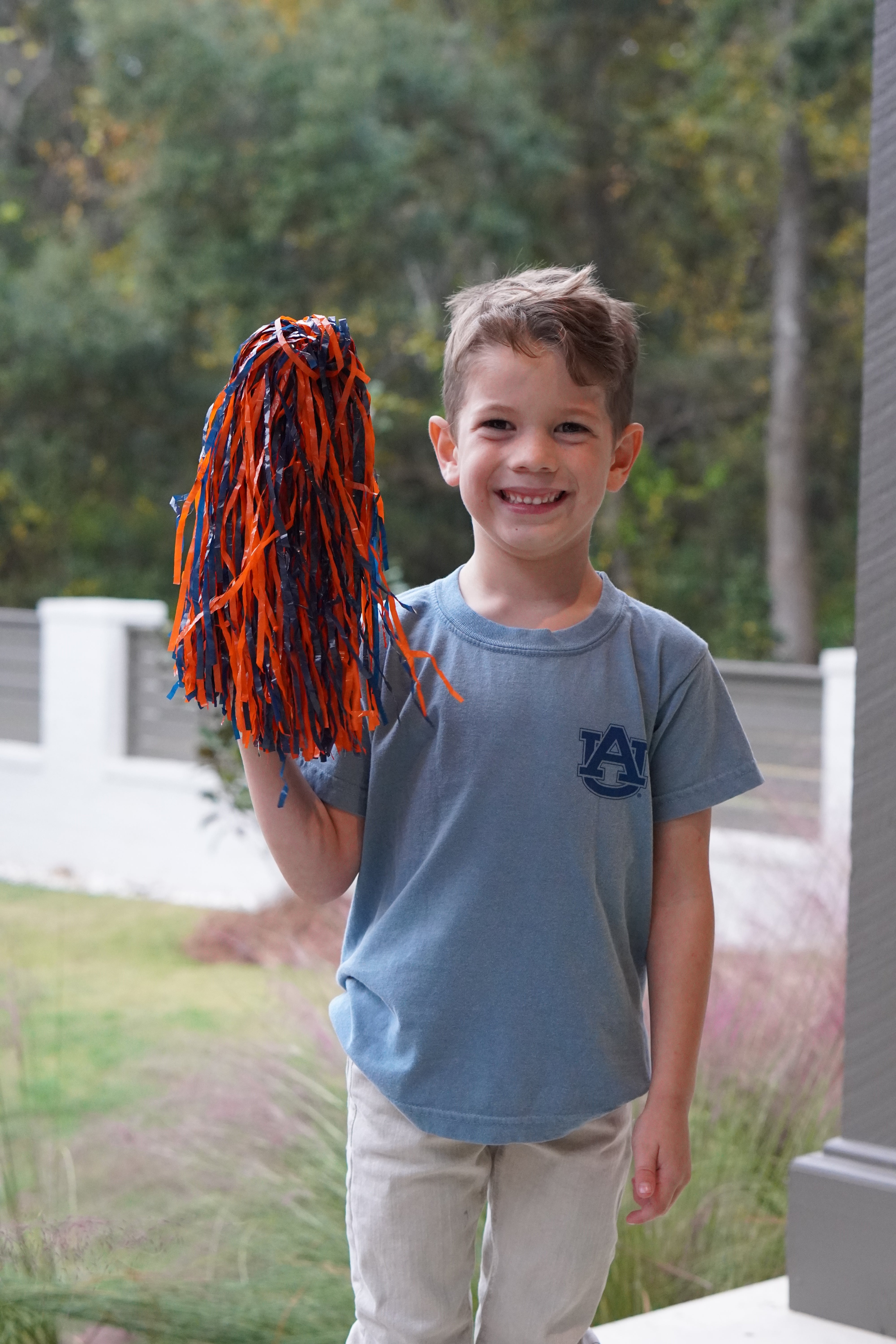 Auburn University Aubie Tiger Walk Ice Blue Gildan Youth Tee with an image of Aubie the Tiger leading a parade under a banner with the text "Tiger Walk"