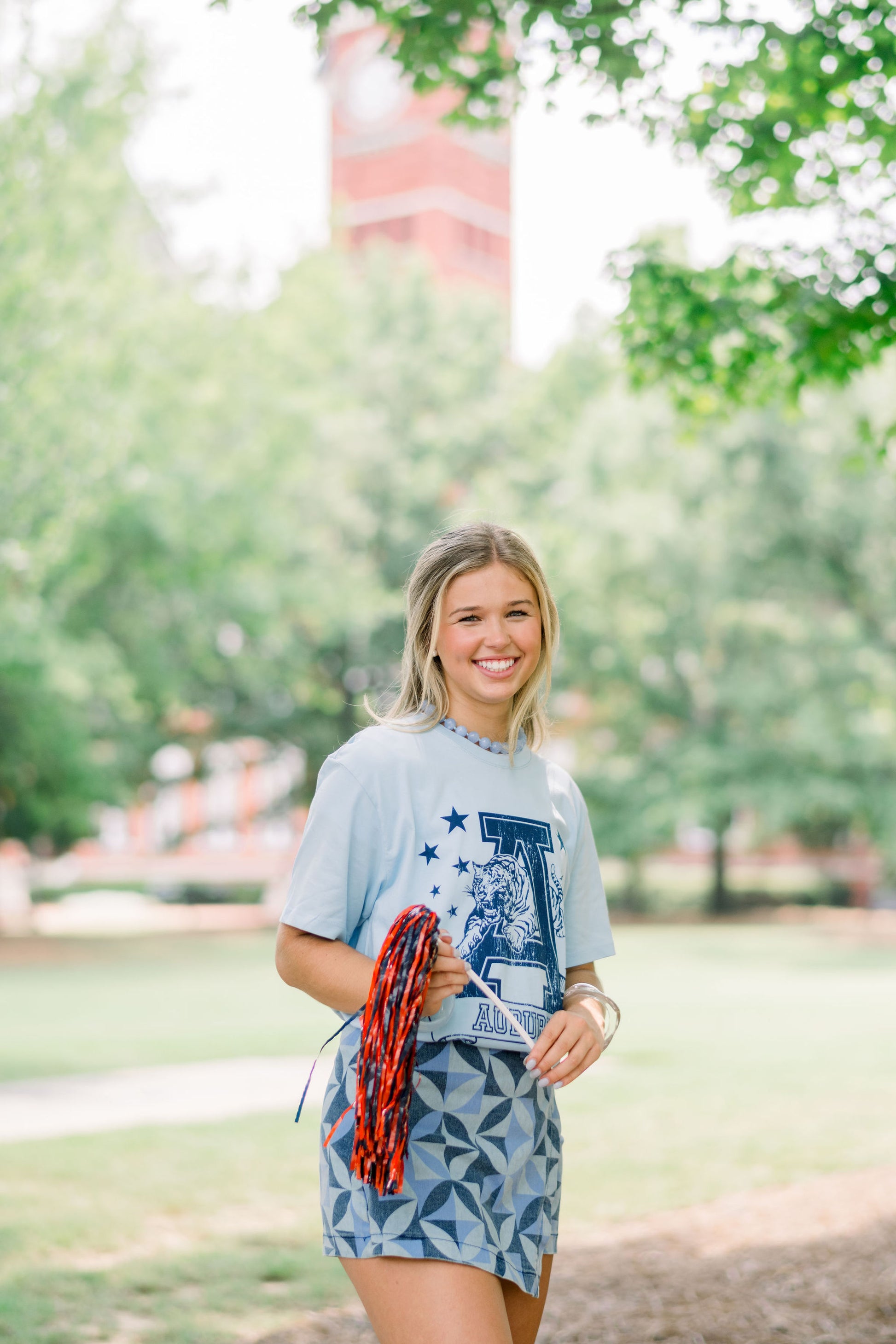 Auburn University Light Blue T-Shirt with Navy stars surrounding a Navy Leaping Tiger Logo