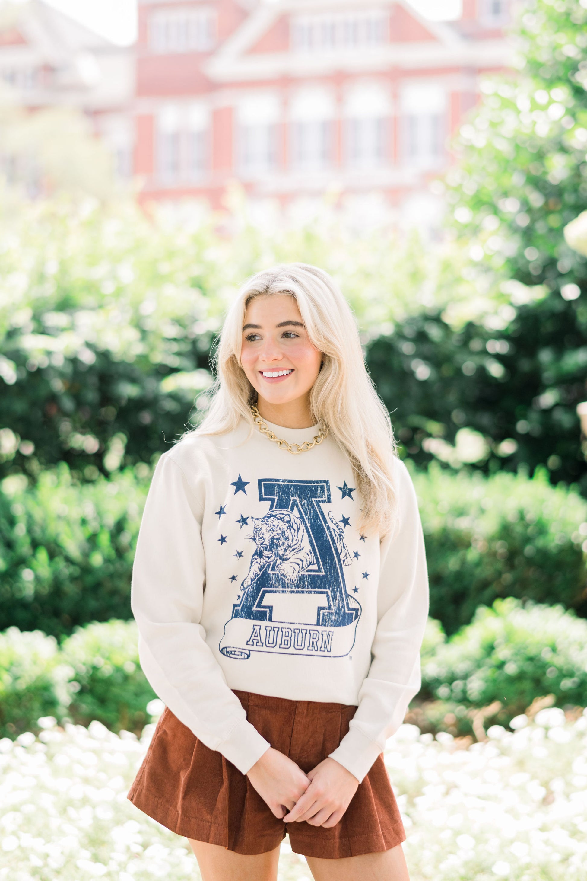 Auburn University Ivory Sweatshirt with Navy stars surrounding a Navy Leaping Tiger Logo