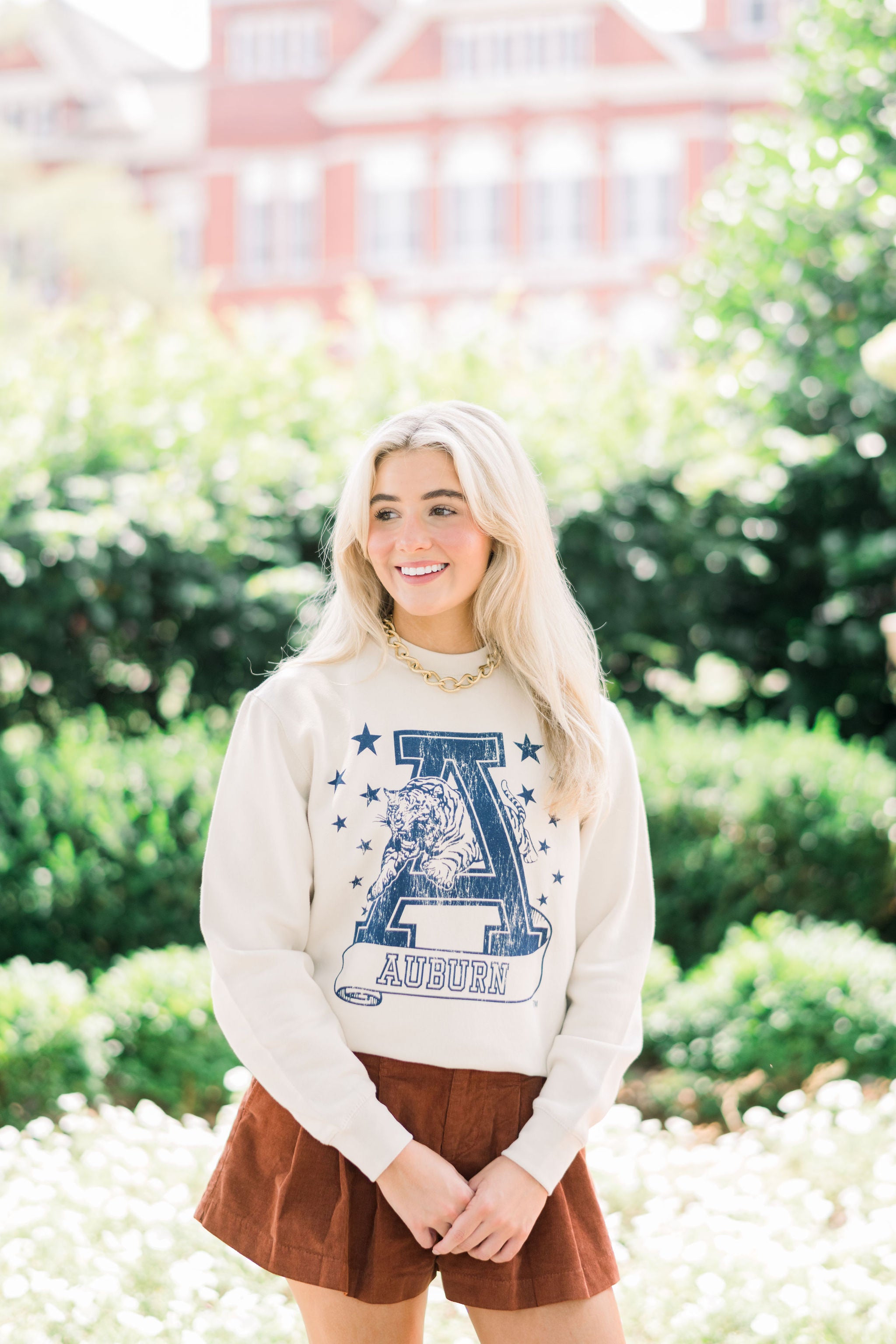 Auburn University Ivory Sweatshirt with Navy stars surrounding a Navy Leaping Tiger Logo