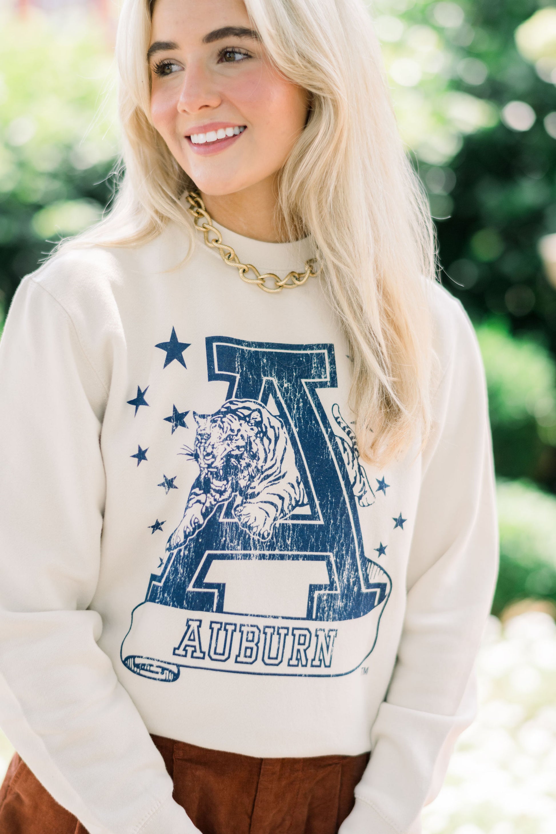 Auburn University Ivory Sweatshirt with Navy stars surrounding a Navy Leaping Tiger Logo