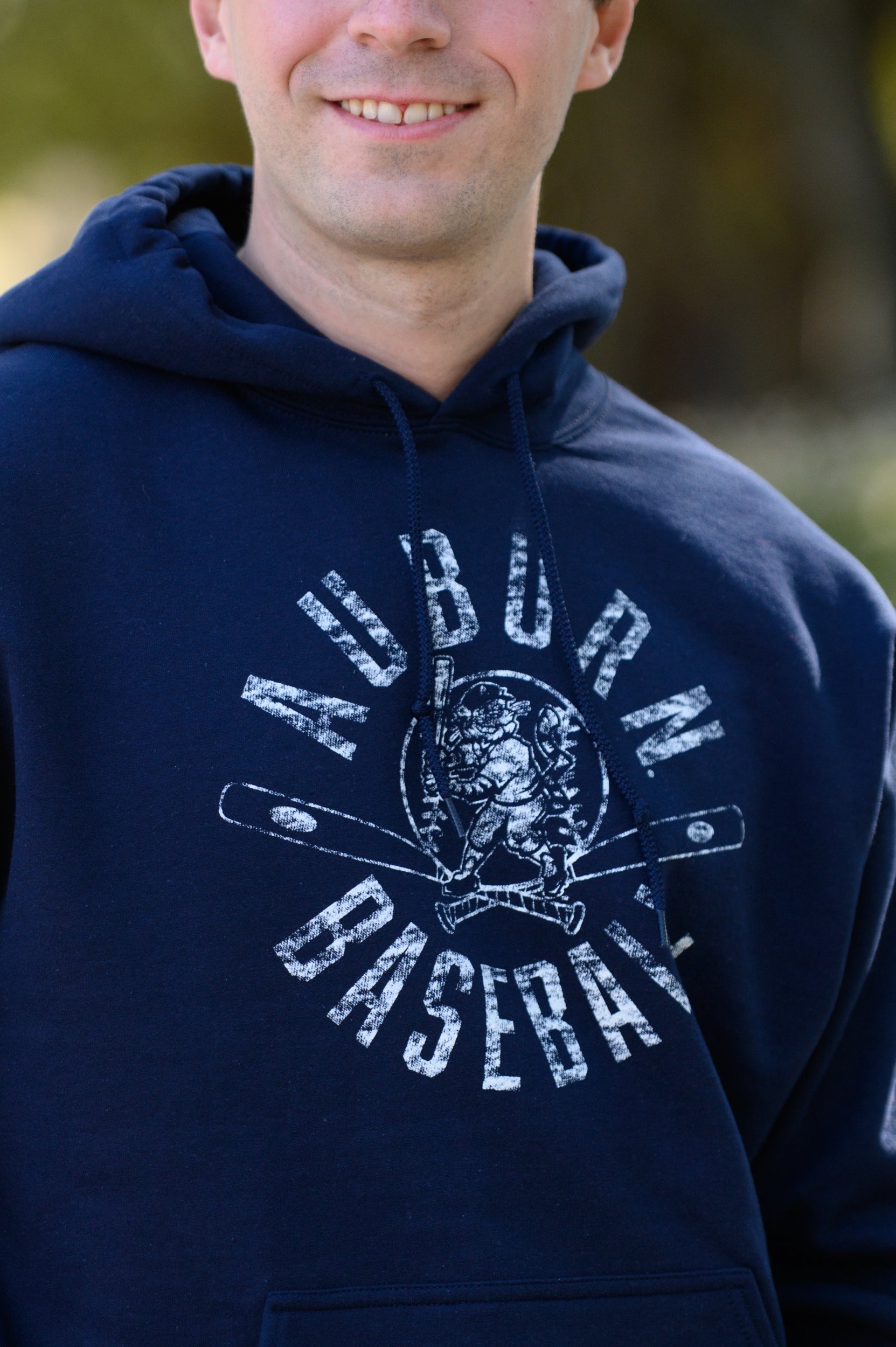 Auburn University Distressed Navy Hoodie with a White Baseball featuring the Original Aubie Baseball logo over crossed baseball bats, surrounded by White text “Auburn Baseball”