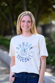 Auburn University Distressed Ivory with a Blue Baseball featuring the Original Aubie Baseball logo over crossed baseball bats, surrounded by Blue text “Auburn Baseball”