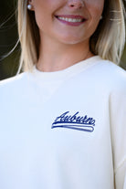 Auburn University Cream Sweatshirt with Navy “Auburn” script and baseball bat embroidery
