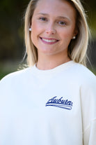Auburn University Cream Sweatshirt with Navy “Auburn” script and baseball bat embroidery