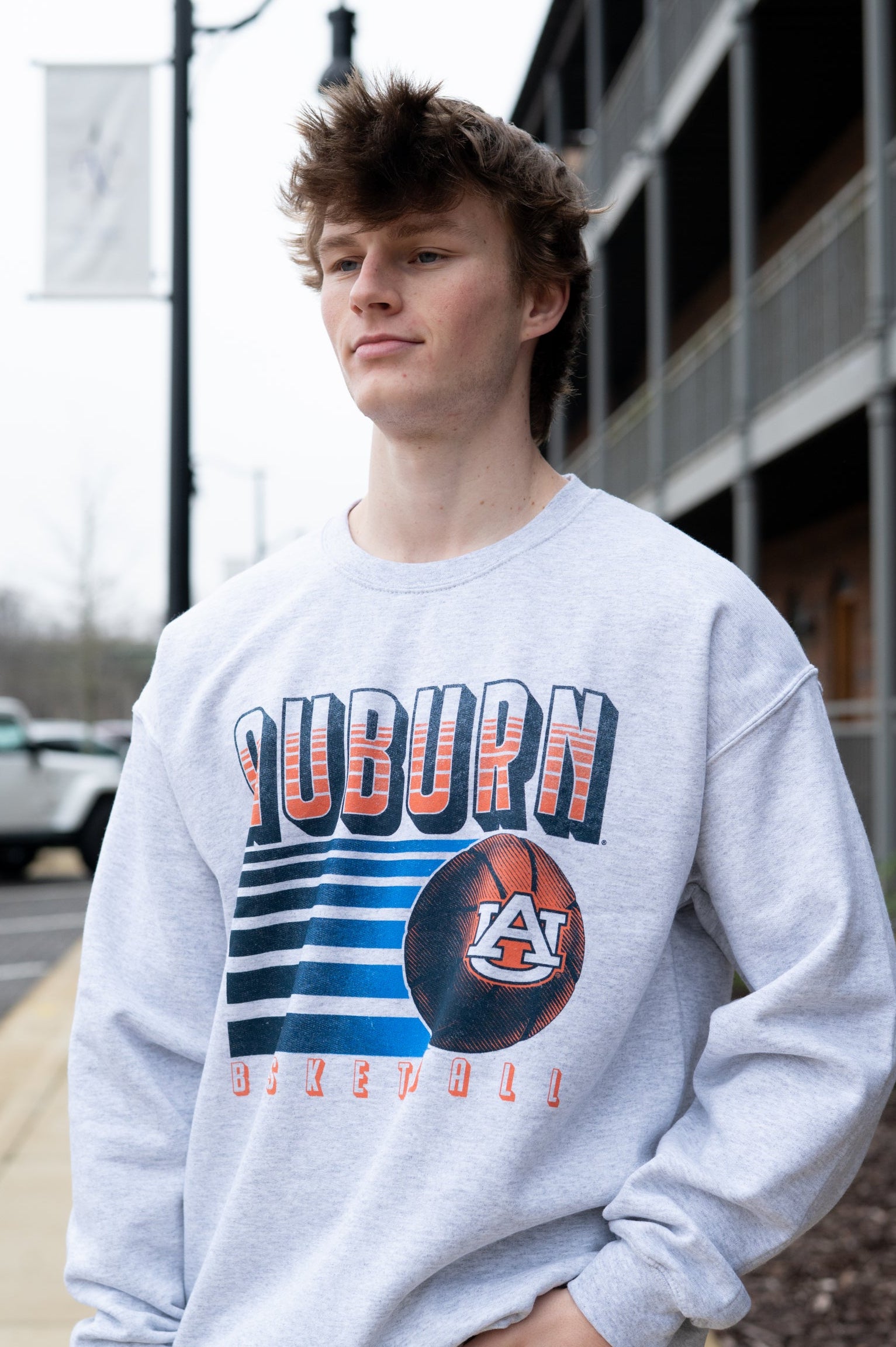 Auburn University Auburn Basketball Vintage White Gildan Sweatshirt with retro style Orange text "Auburn" and an image of a basketball with the AU Logo