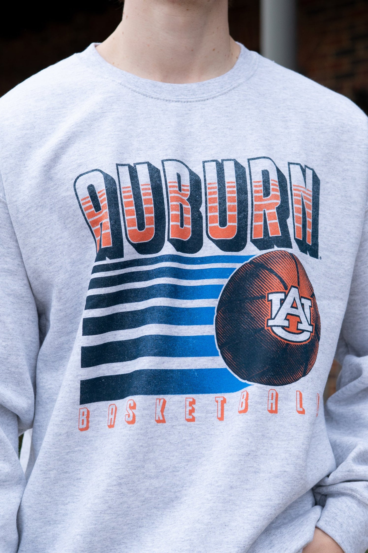 Auburn University Auburn Basketball Vintage White Gildan Sweatshirt with retro style Orange text "Auburn" and an image of a basketball with the AU Logo